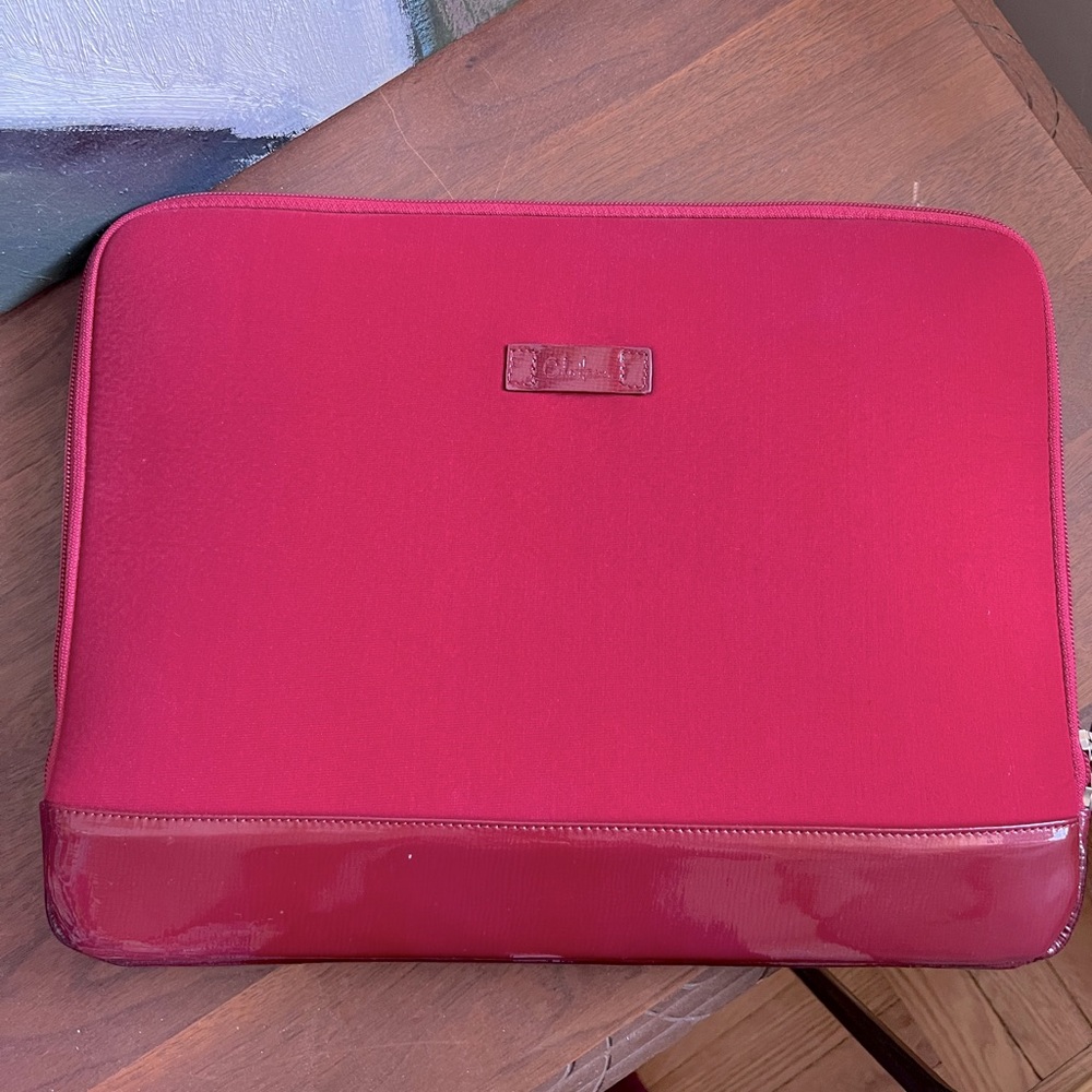 Cherry red neoprene and patent laptop sleeve from Cole Haan. Fits 14” laptop.